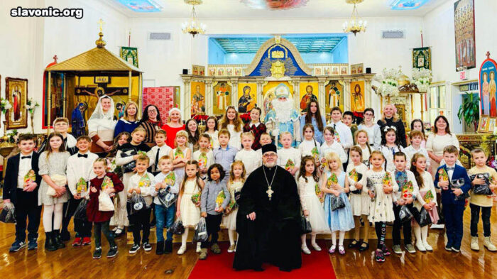 Archpriest Alexander Belya with Sunday school children